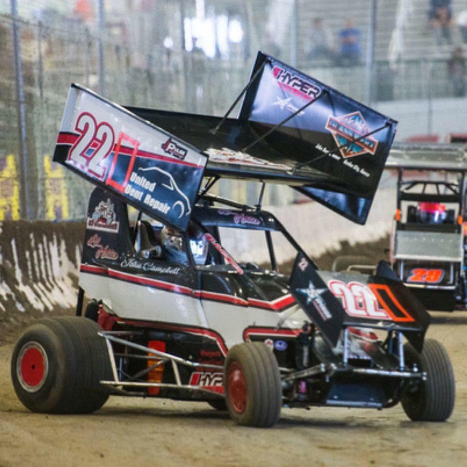 Mini sprint race car on an indoor dirt track
