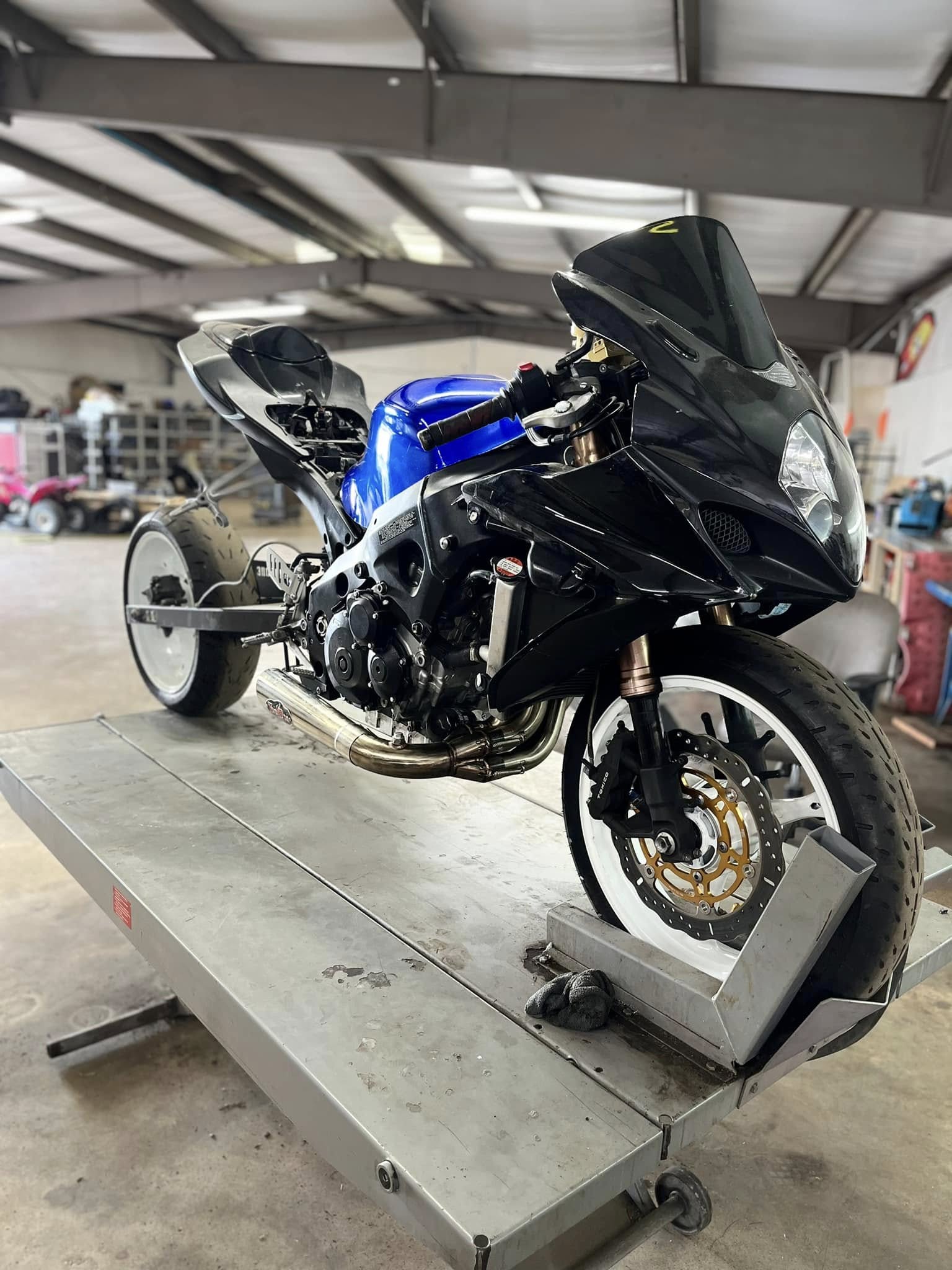Black and blue sport motorcycle in the Action Motorsports shop